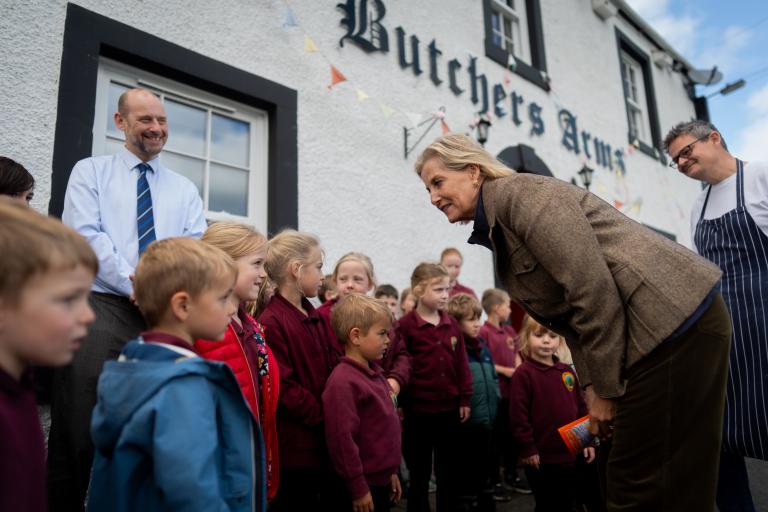 HRH The Duchess of Edinburgh meets local school children outside The Butchers Arms. 