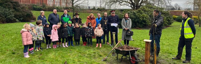 The Lord-Lieutenant and High Sheriff with local dignitaries and pupils from the local primary school.